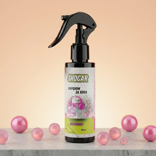 Spray bottle with 'Shocar' label on a light pink background with pink balls around