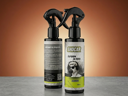 Two Shocar care products on a gray surface with an orange background