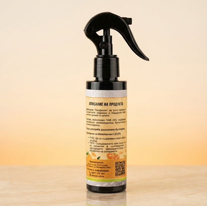 Spray bottle with a label on a wooden surface and gradient background